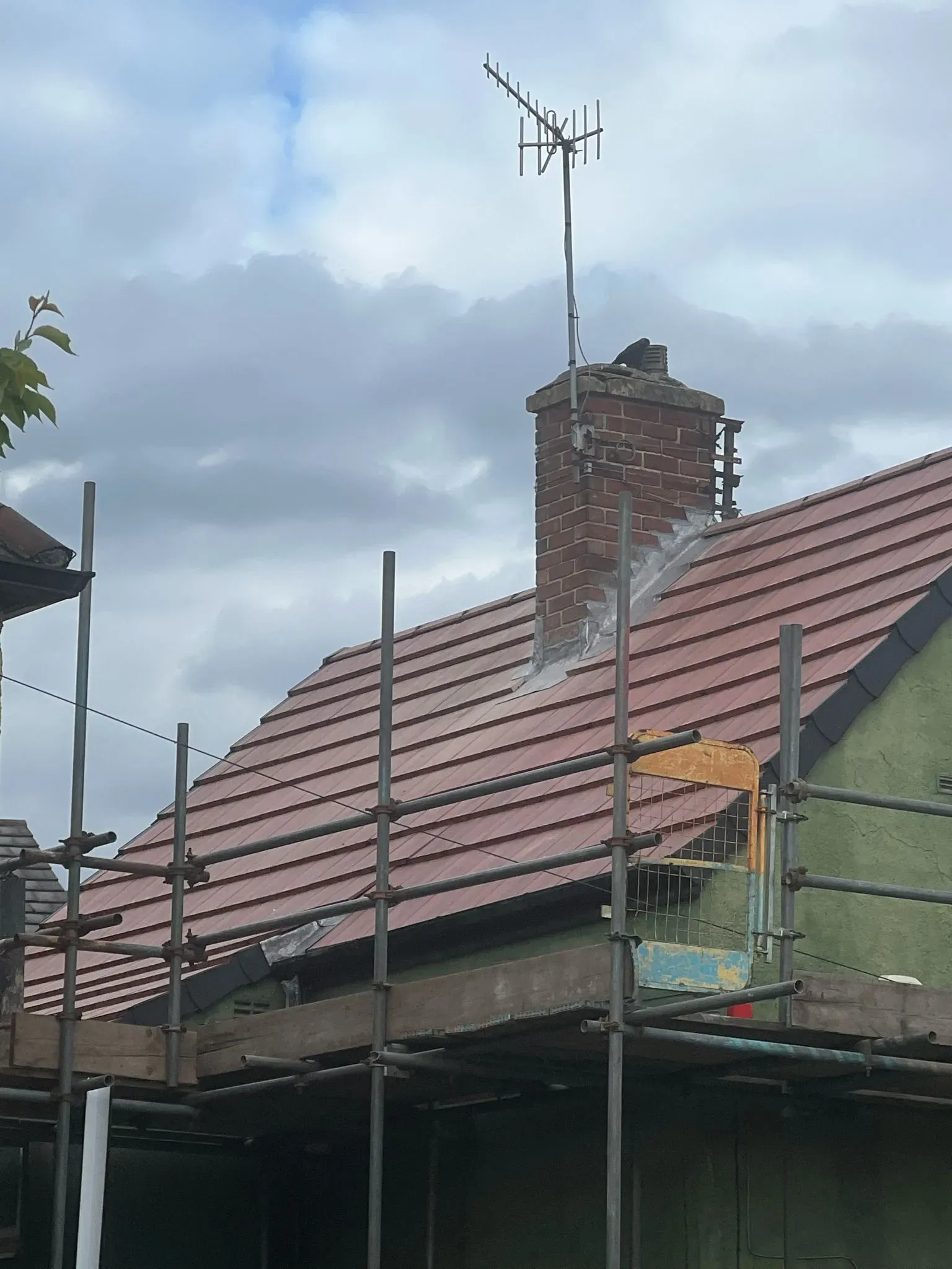 Pitched roof repair with scaffolding, chimney, and lead flashing in Sheffield or the Peak District
