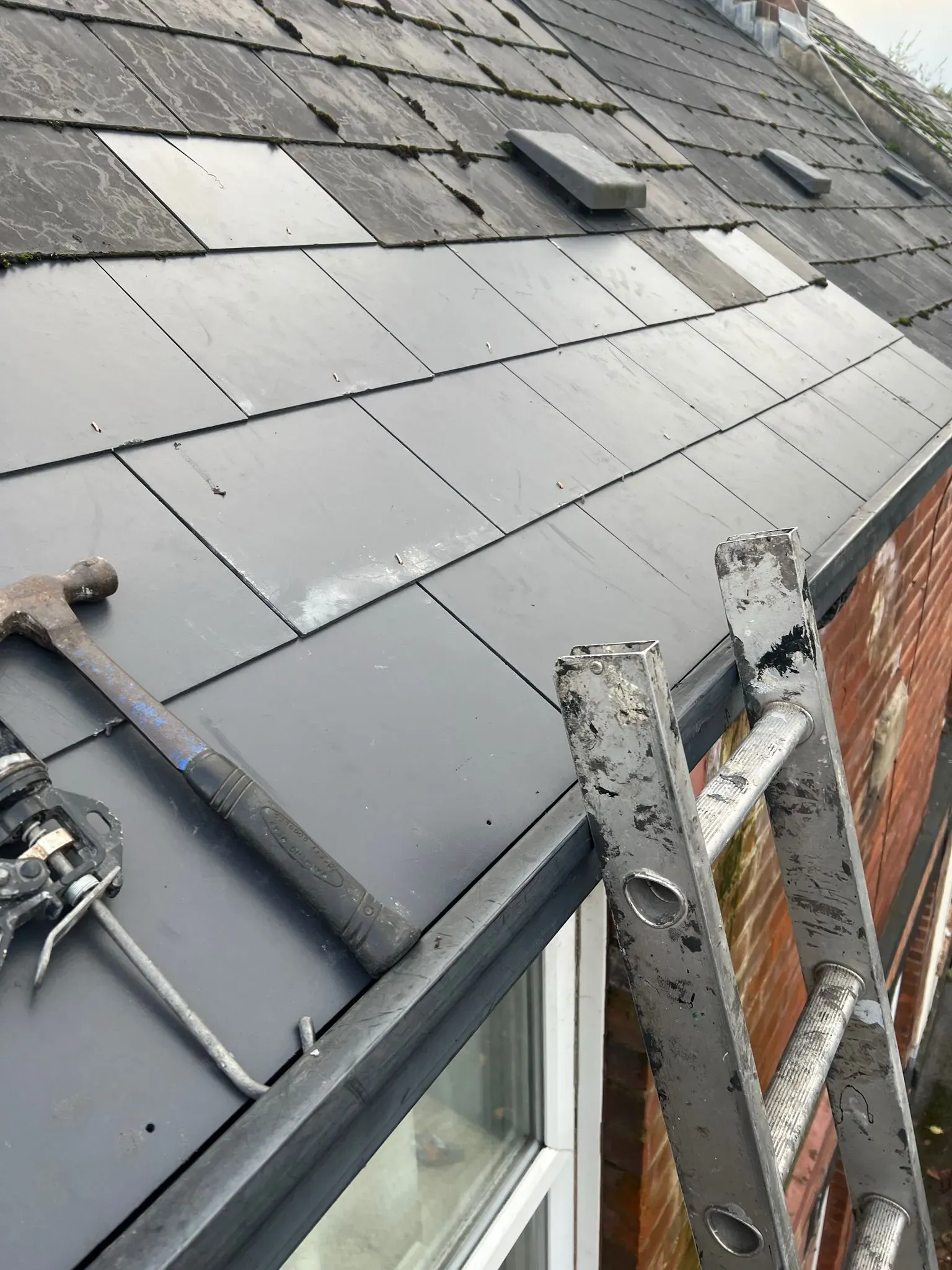 Roof tiling in progress on a pitched roof in Sheffield