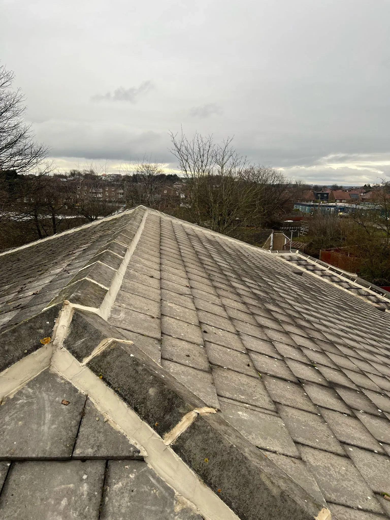 Tiled pitched roof ridge with old mortar in Sheffield or Peak District