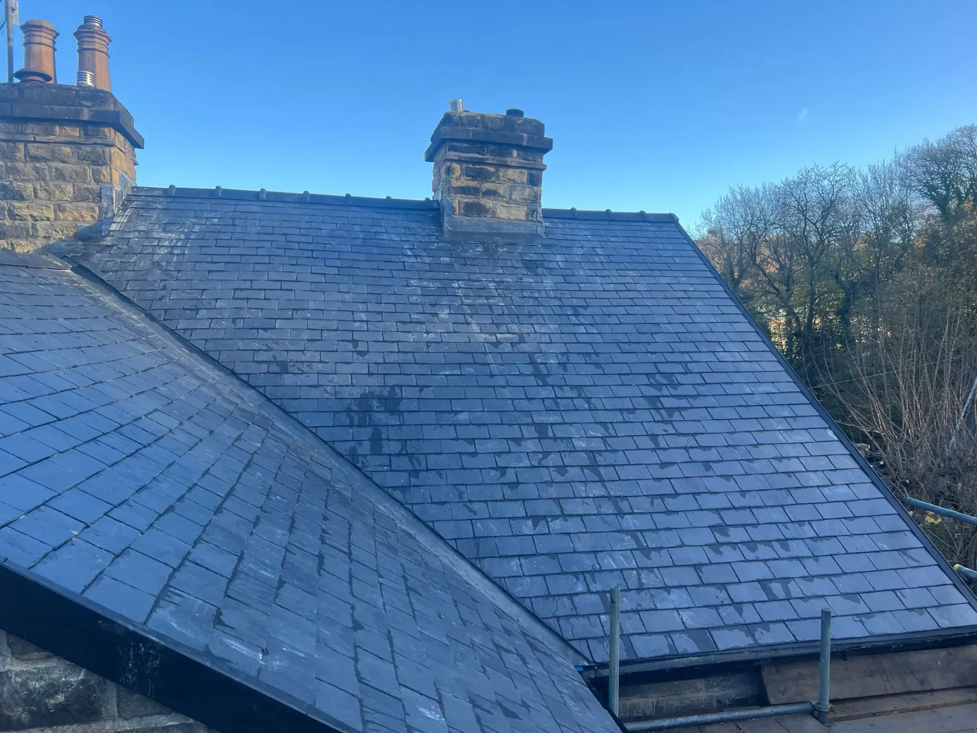 High quality slate roof with chimneys on a property in Sheffield or the Peak District.