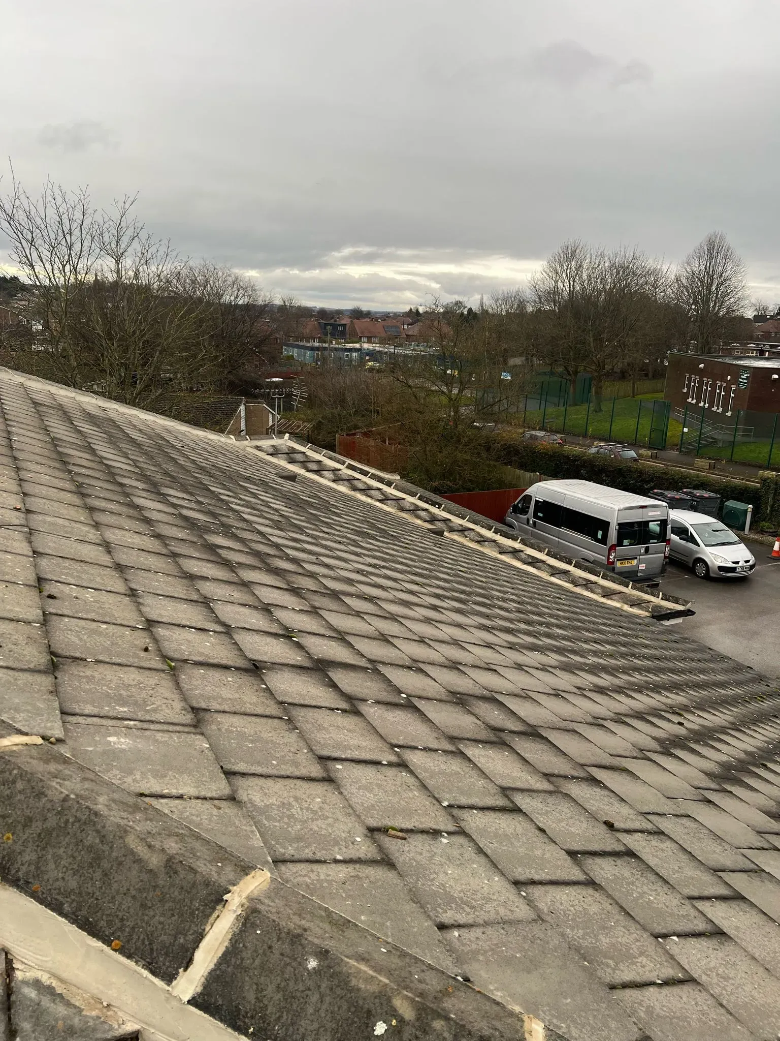 Pitched tiled roof showing weathering in Sheffield