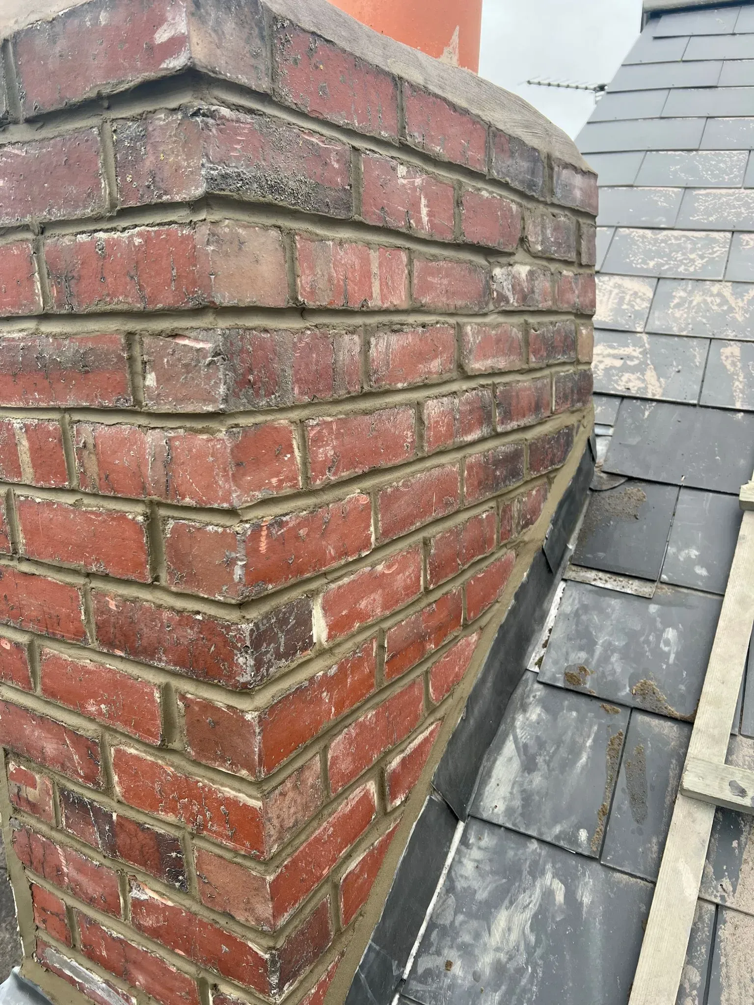 Expert chimney repair in Sheffield showing repointed brickwork and new lead flashing