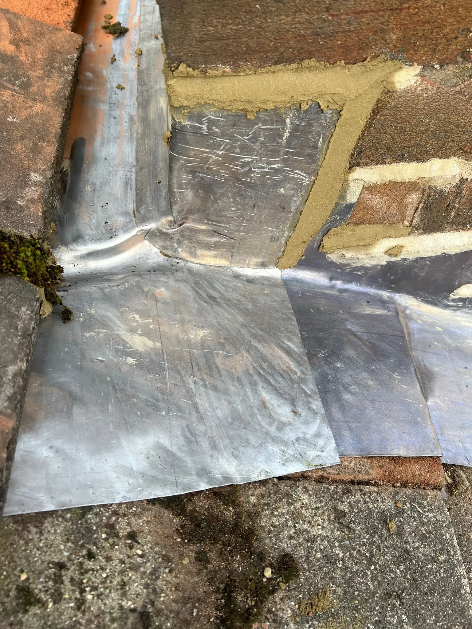 Lead flashing where a roof meets a wall