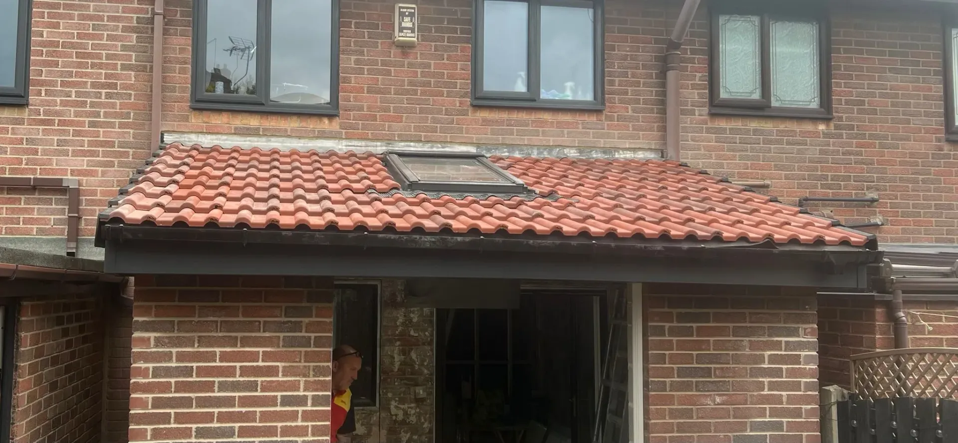 Newly installed tiled pitched roof with Velux window on a building extension in Sheffield or the Peak District.