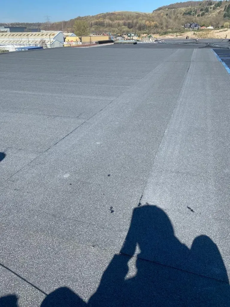 A picture of a durable flat roof installed by Alliance Roofing Services.