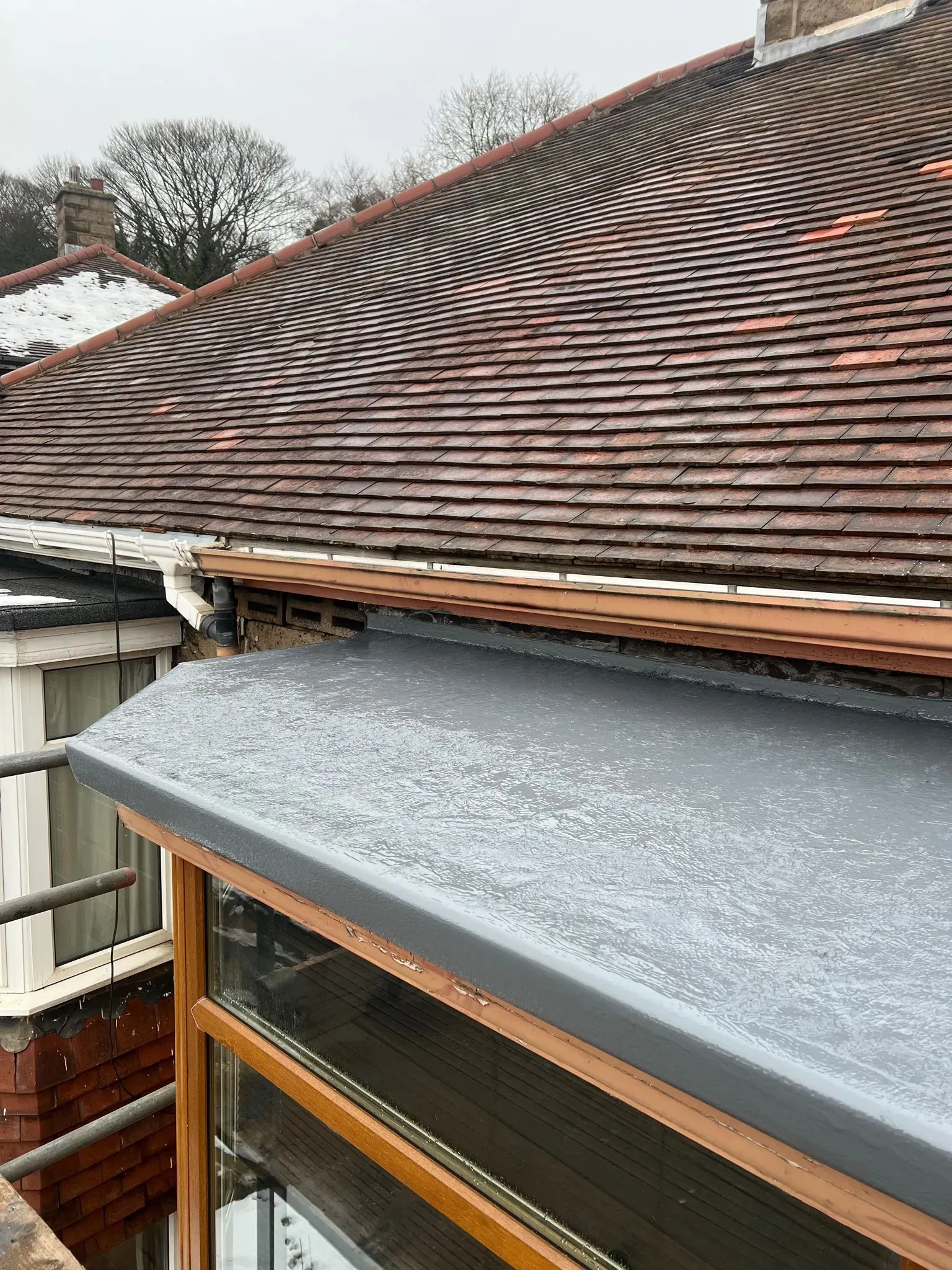 New flat roof on extension next to pitched tiled roof, Sheffield or Peak District